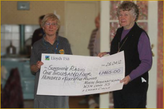 Sue Walker being presented with the cheque by Carol White
