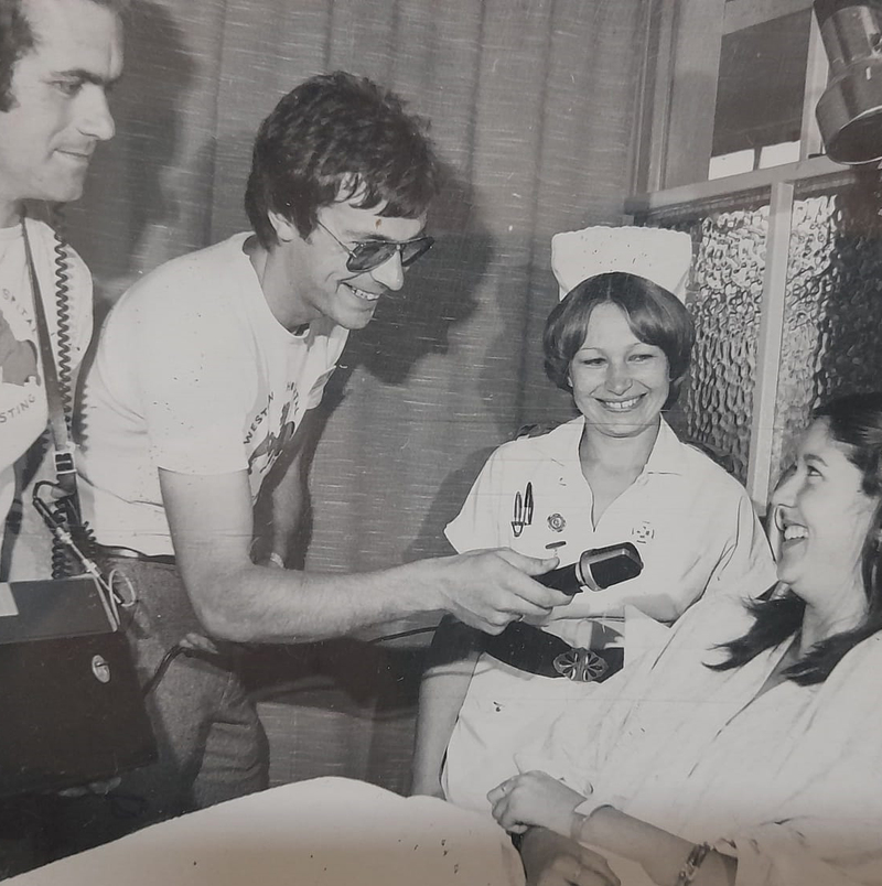 Collecting song requests and recording messages from the patients.